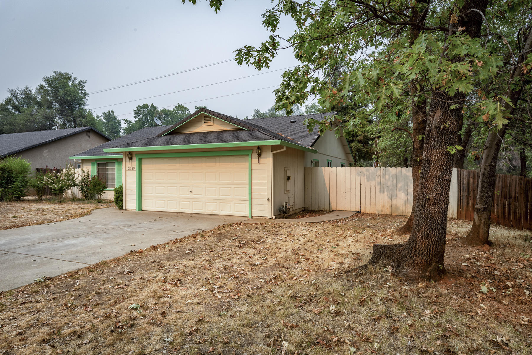3339 Lawrence Road Redding, CA 96002 - Photo 1 of 18 a house with a tree in front of it