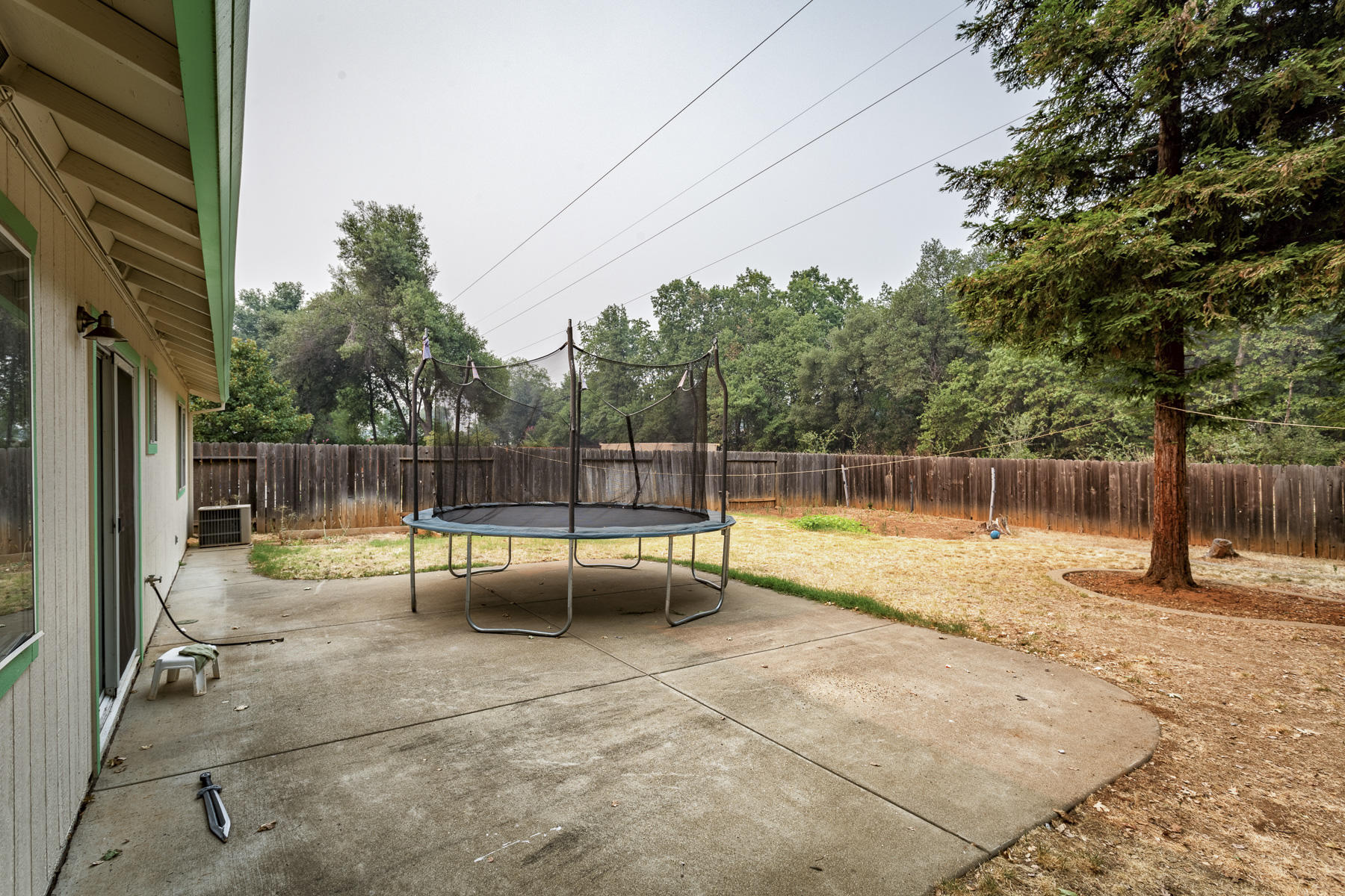 3339 Lawrence Road Redding, CA 96002 - Photo 14 of 18 a view of a backyard with swimming pool