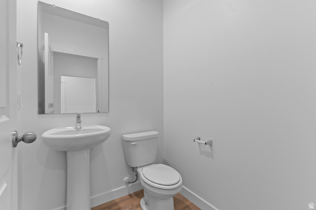 2829 South 710th West, Unit 17 Logan, UT 84321 - Photo 7 of 22 Bathroom featuring toilet and wood finished floors