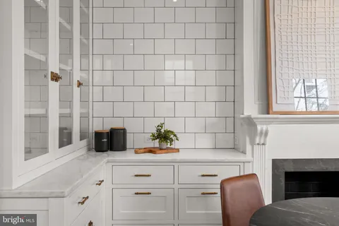 a kitchen with a sink cabinets and appliances