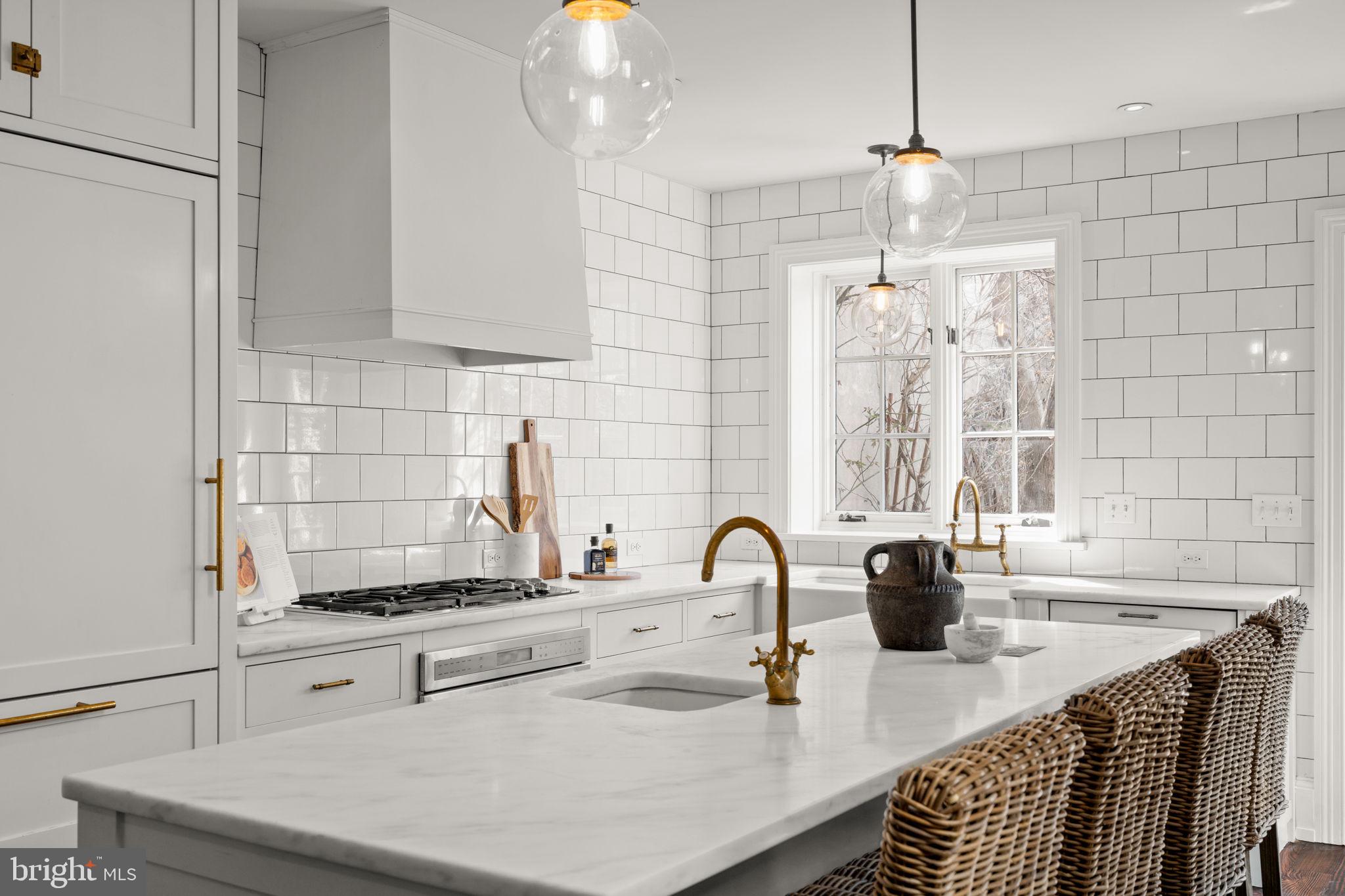 604 Spruce Street Philadelphia, PA 19106 - Photo 18 of 69 a kitchen with stainless steel appliances a sink a counter space and cabinets