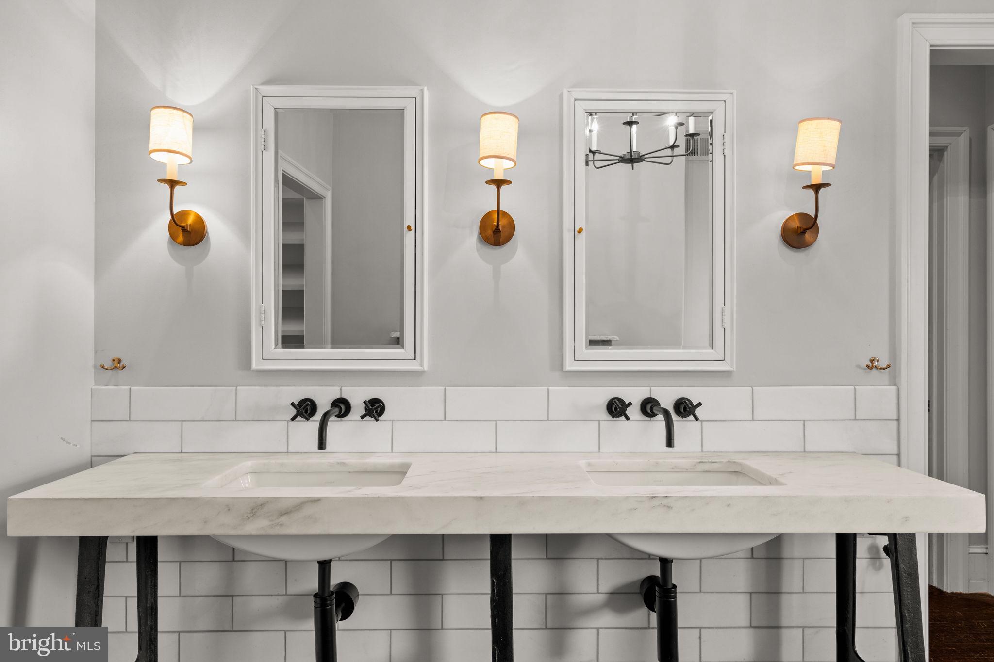 604 Spruce Street Philadelphia, PA 19106 - Photo 27 of 69 a bathroom with a sink and a mirror