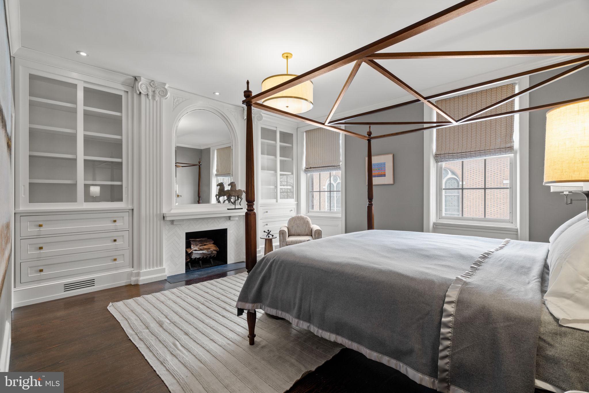 604 Spruce Street Philadelphia, PA 19106 - Photo 36 of 69 a bedroom with a bed and a fireplace