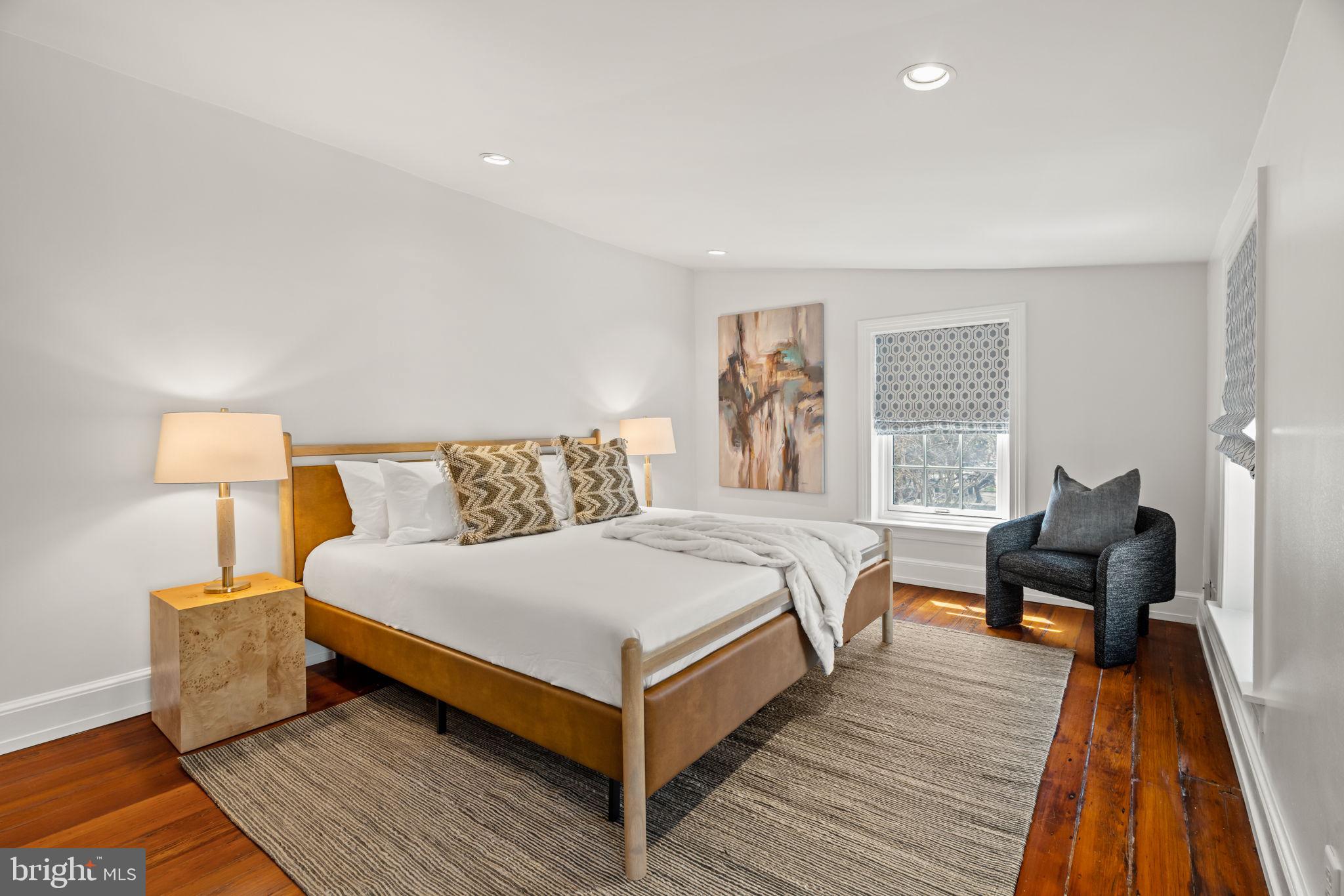 604 Spruce Street Philadelphia, PA 19106 - Photo 42 of 69 a bedroom with a bed and wooden floor