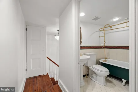 a view of an empty room with a closet