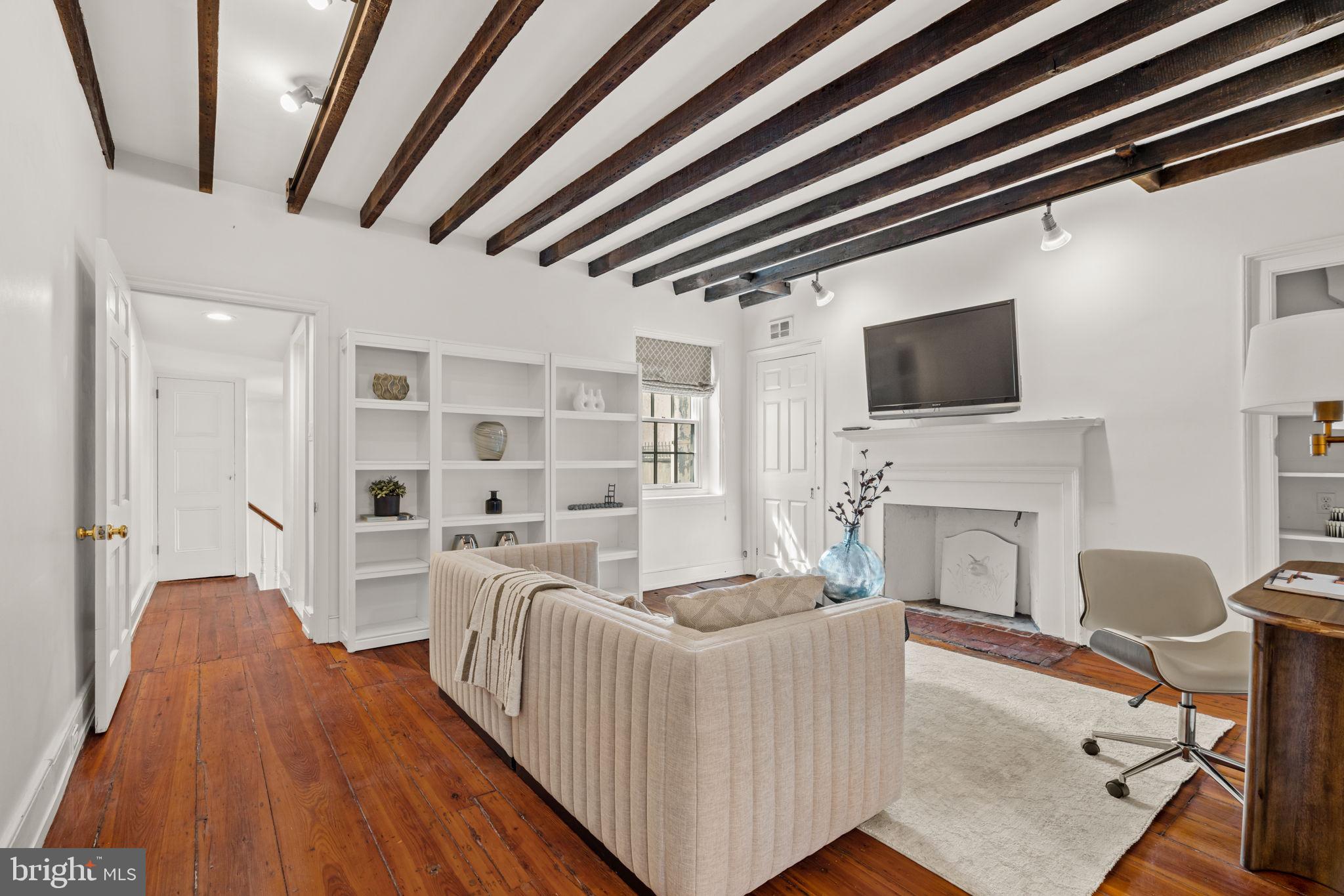 604 Spruce Street Philadelphia, PA 19106 - Photo 46 of 69 a living room with furniture and a fireplace