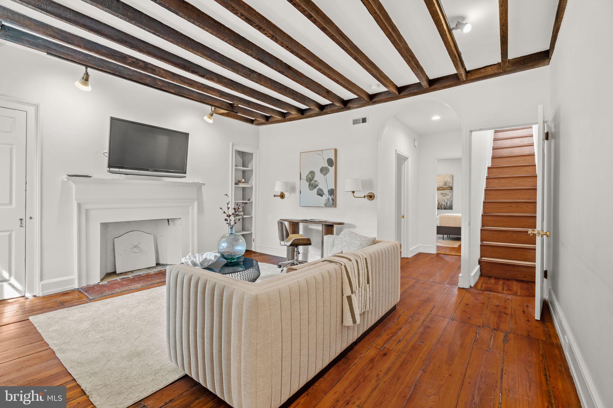 604 Spruce Street Philadelphia, PA 19106 - Photo 48 of 69 a living room with furniture a flat screen tv and a fireplace