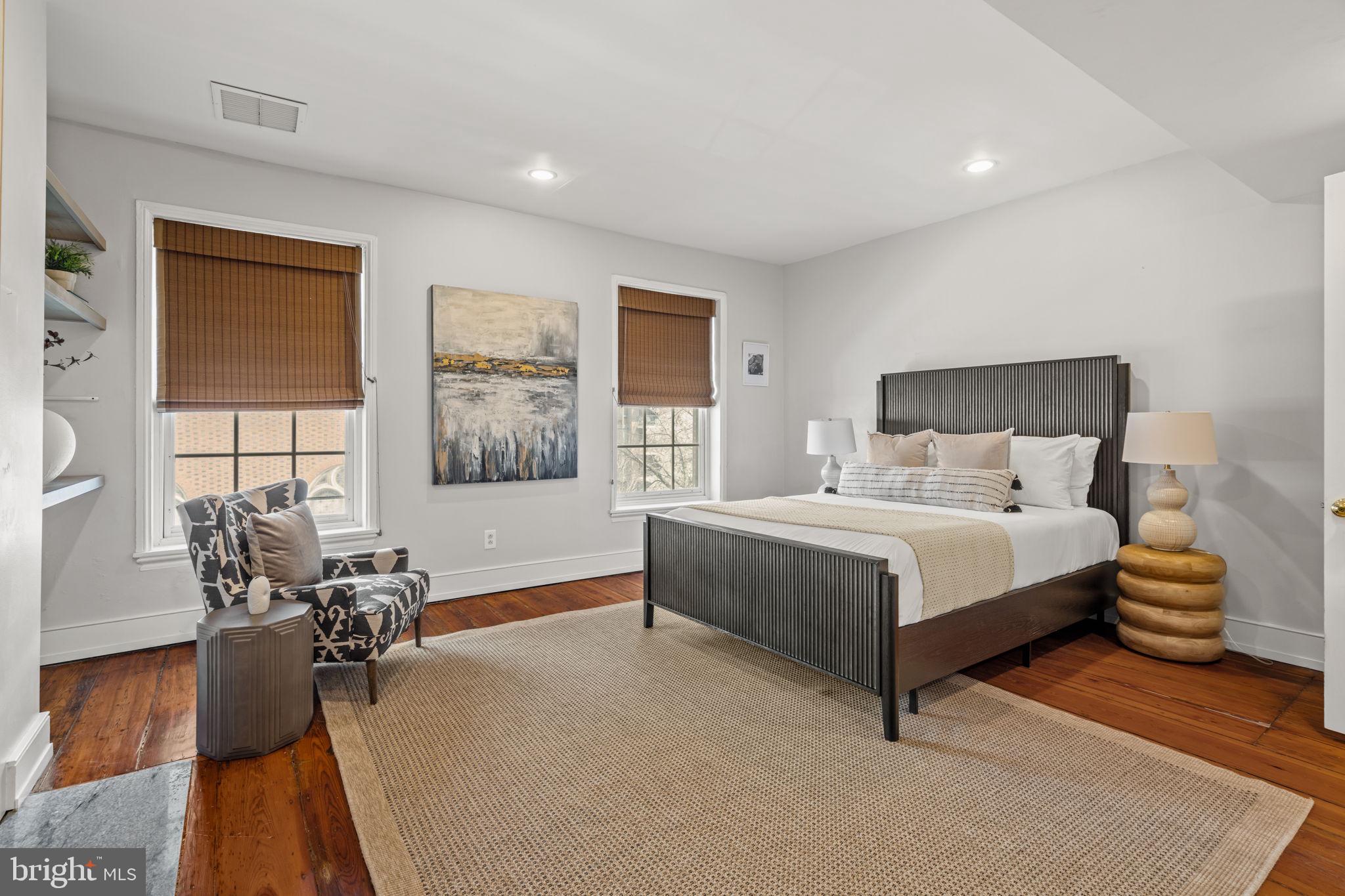 604 Spruce Street Philadelphia, PA 19106 - Photo 50 of 69 a bedroom with a bed and wooden floor