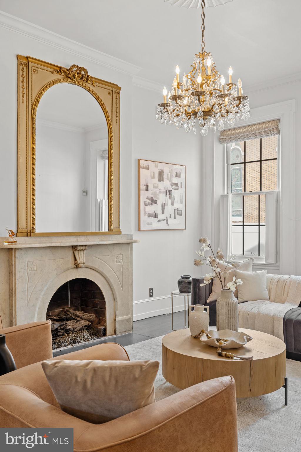 604 Spruce Street Philadelphia, PA 19106 - Photo 5 of 69 a living room with furniture a chandelier and a fireplace