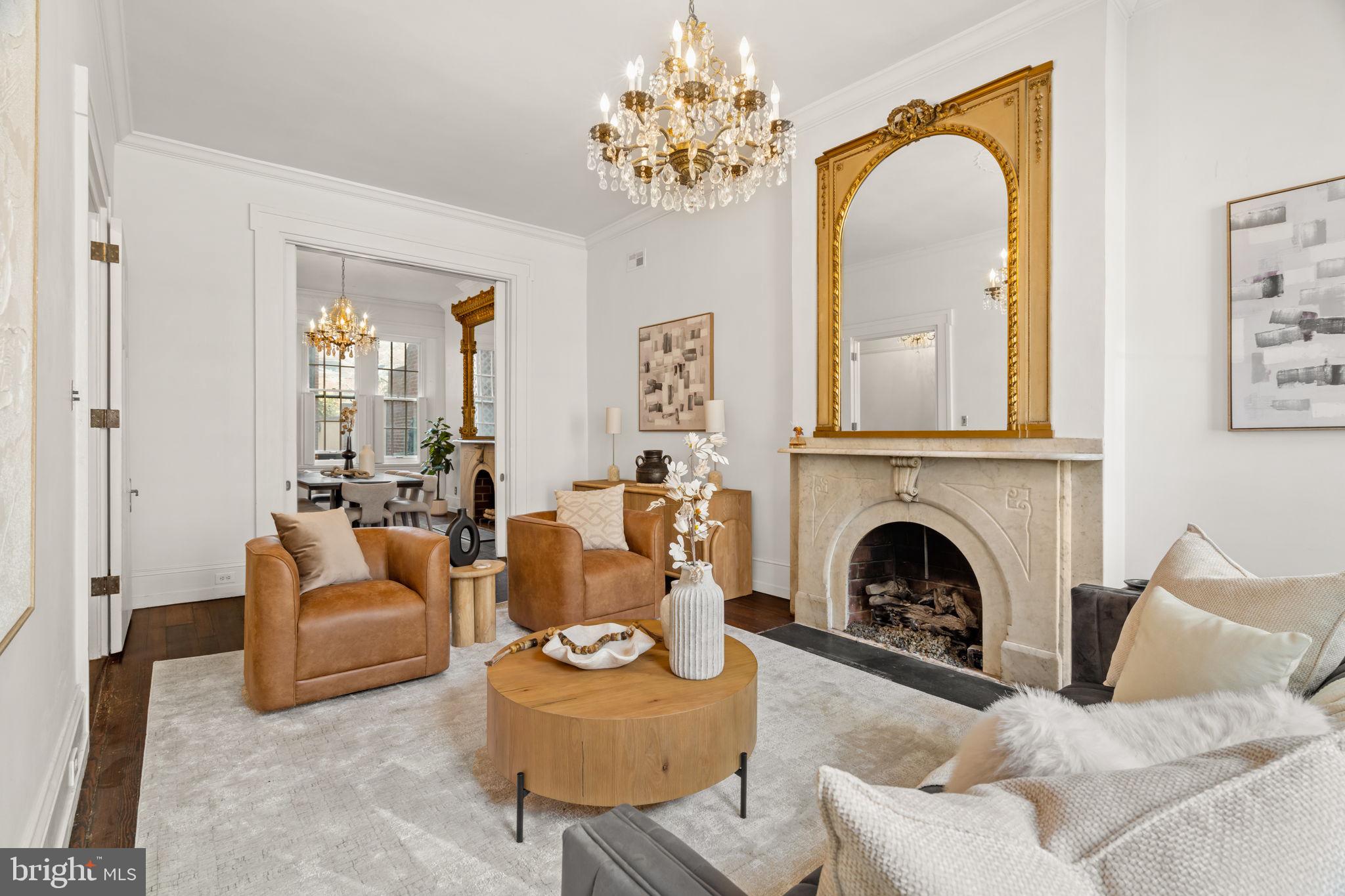 604 Spruce Street Philadelphia, PA 19106 - Photo 10 of 69 a living room with furniture a fireplace and a chandelier