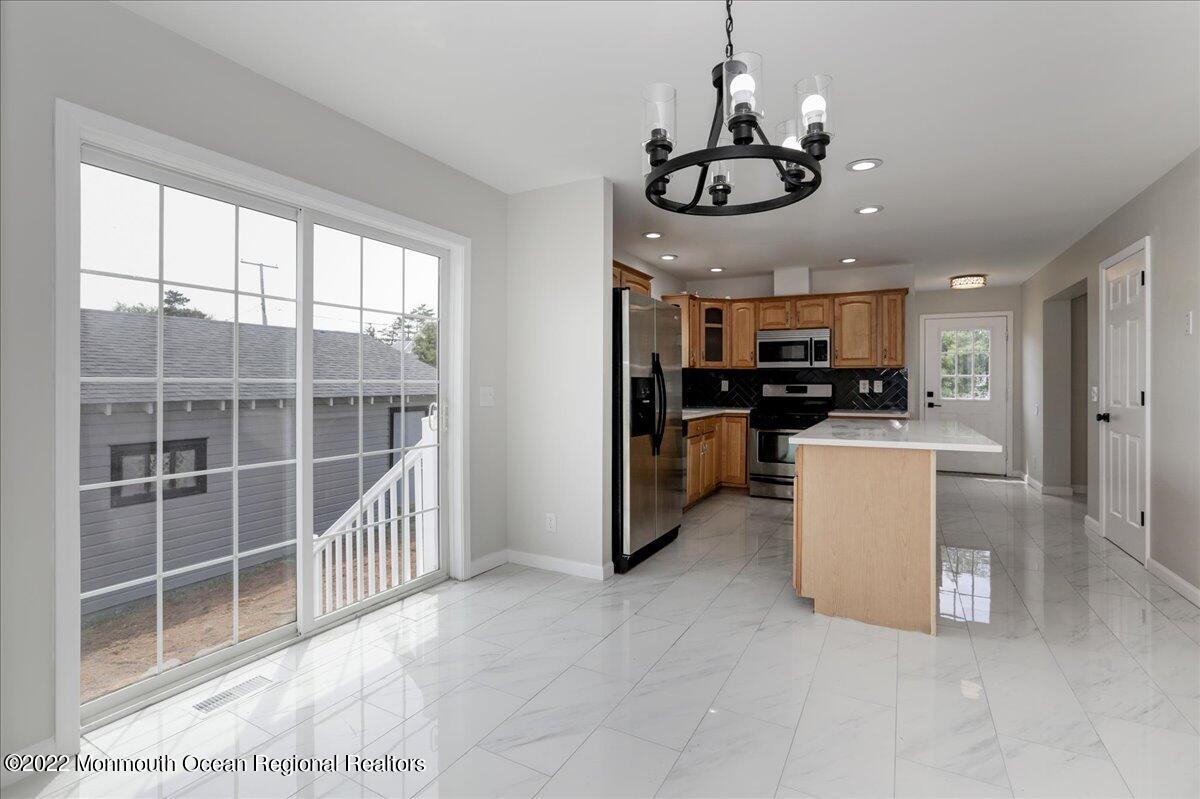 110 Island Road Toms River, NJ 08753 - Photo 15 of 51 a view of a kitchen and microwave