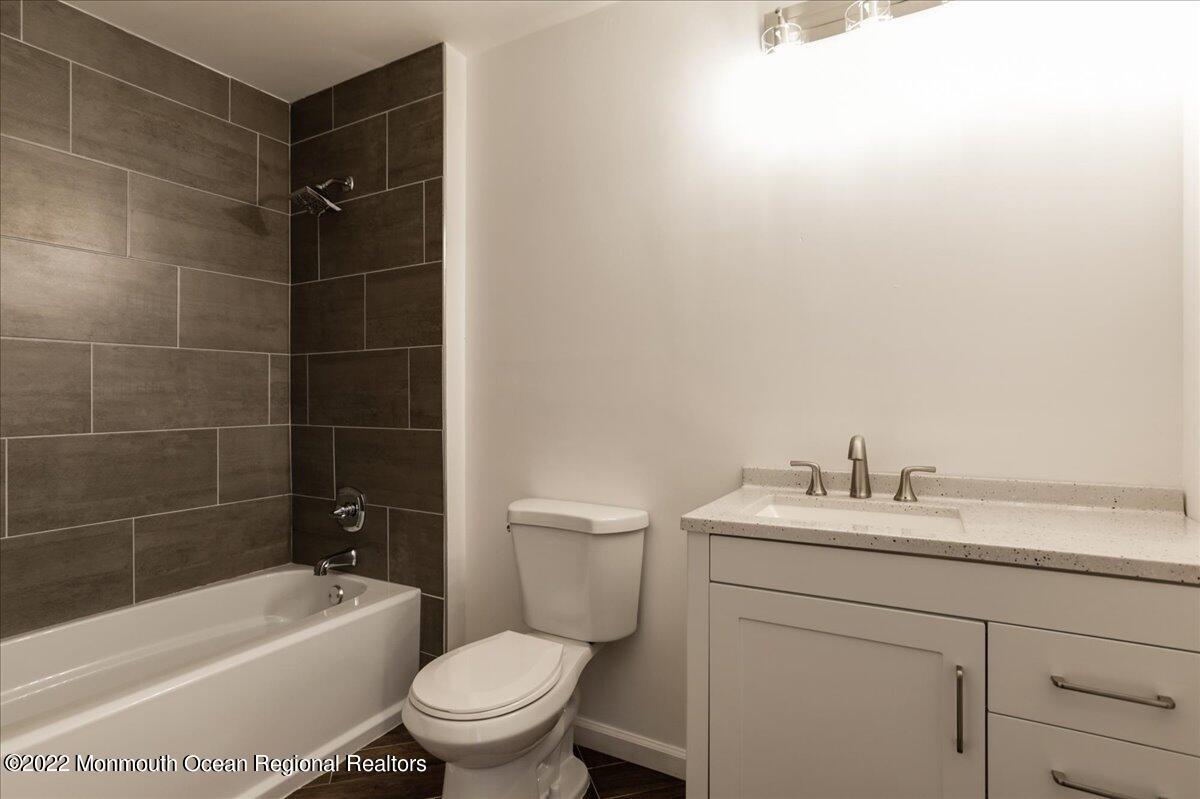 110 Island Road Toms River, NJ 08753 - Photo 34 of 51 a bathroom with a sink toilet vanity and tub