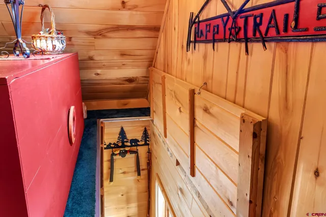 a big yard with table and chairs under an umbrella
