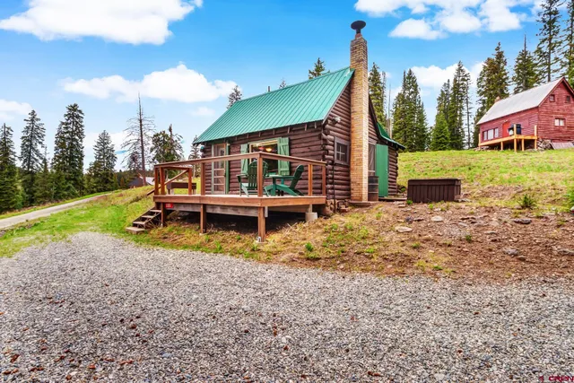 a view of a backyard with sitting area