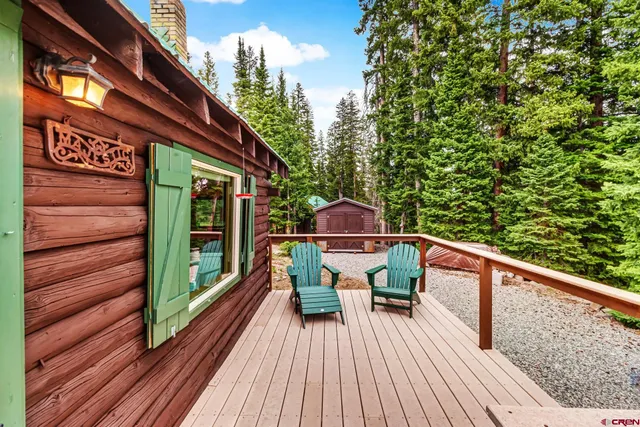 a balcony view with a seating space