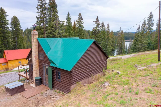 a backyard of a house with outdoor seating