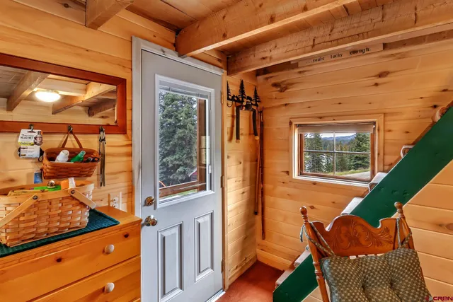 a view of a porch with furniture and a window