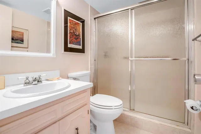 a room with lots of furniture and a potted plant