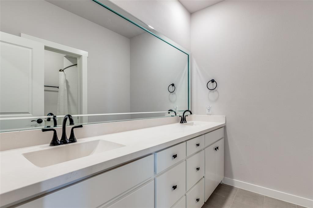 720 Bandera Court Prosper, TX 75078 - Photo 12 of 24 a bathroom with a sink and a mirror