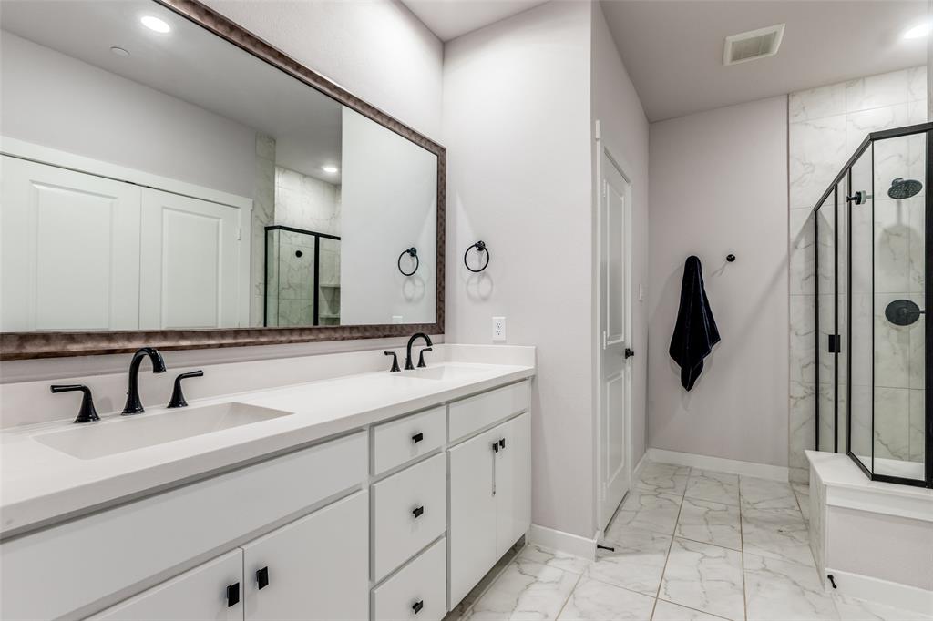 720 Bandera Court Prosper, TX 75078 - Photo 15 of 24 a bathroom with a double vanity sink and mirror