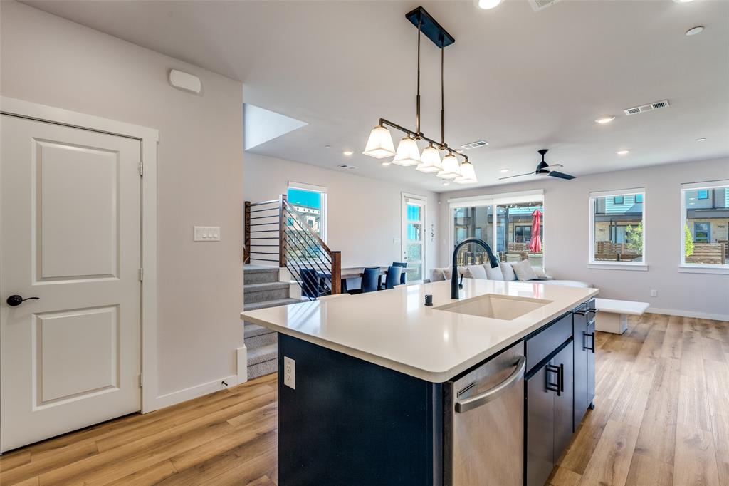 720 Bandera Court Prosper, TX 75078 - Photo 8 of 24 a view of kitchen island a sink and wooden floor