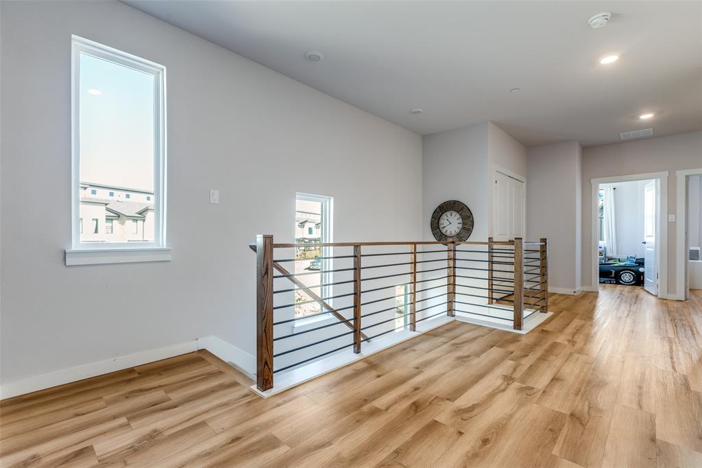 720 Bandera Court Prosper, TX 75078 - Photo 9 of 24 a view of a room with wooden floor and window