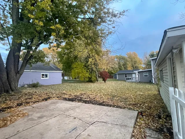 a view of a backyard of the house