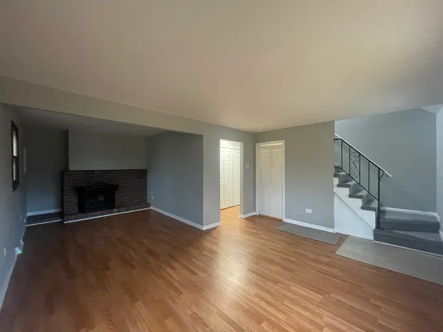 a kitchen with a refrigerator a sink and cabinets