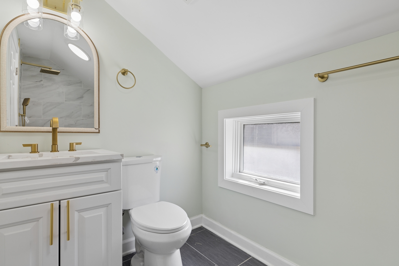 6347 South Kenneth Avenue Chicago, IL 60629 - Photo 21 of 40 a bathroom with a toilet sink and mirror