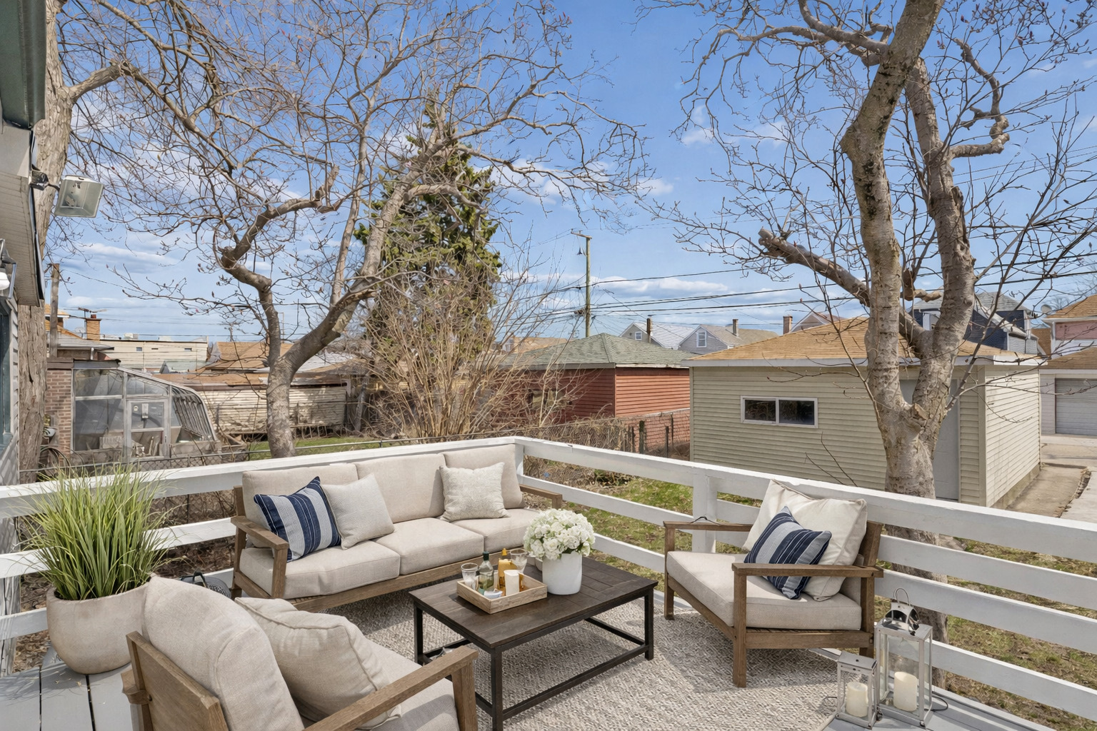 6347 South Kenneth Avenue Chicago, IL 60629 - Photo 26 of 40 a roof deck with couches and wooden fence