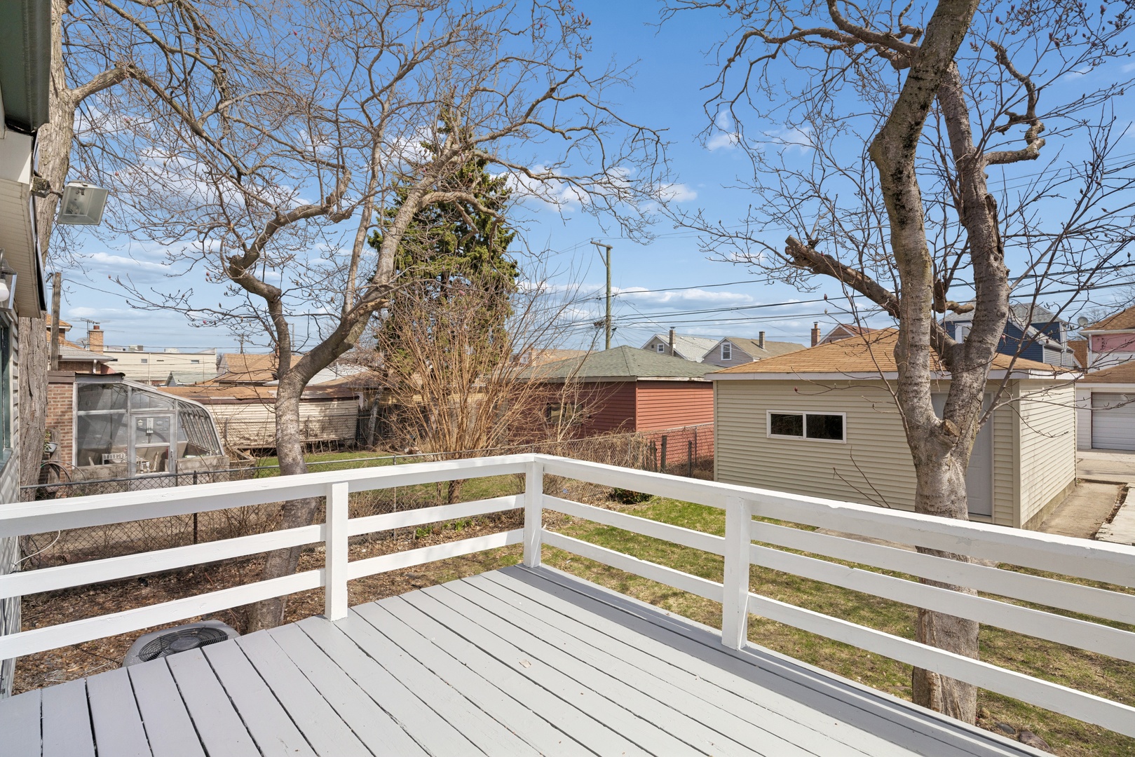 6347 South Kenneth Avenue Chicago, IL 60629 - Photo 27 of 40 a view of backyard with large trees and wooden fence