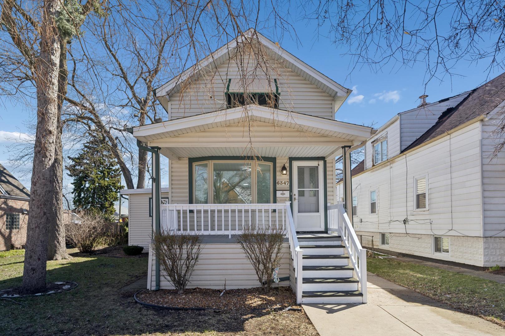 6347 South Kenneth Avenue Chicago, IL 60629 - Photo 40 of 40 a front view of a house with a yard