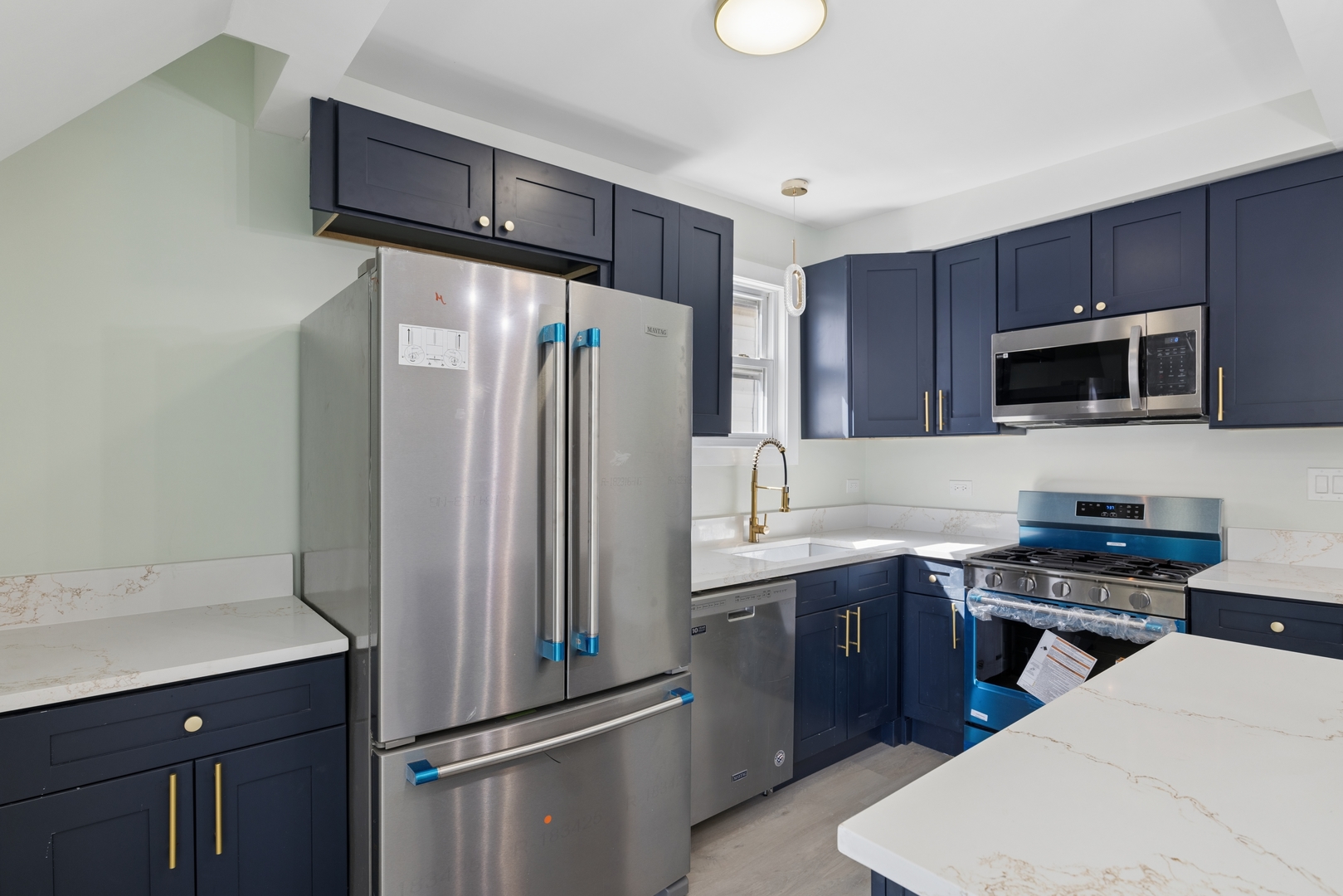 6347 South Kenneth Avenue Chicago, IL 60629 - Photo 4 of 40 a kitchen with a refrigerator sink and cabinets