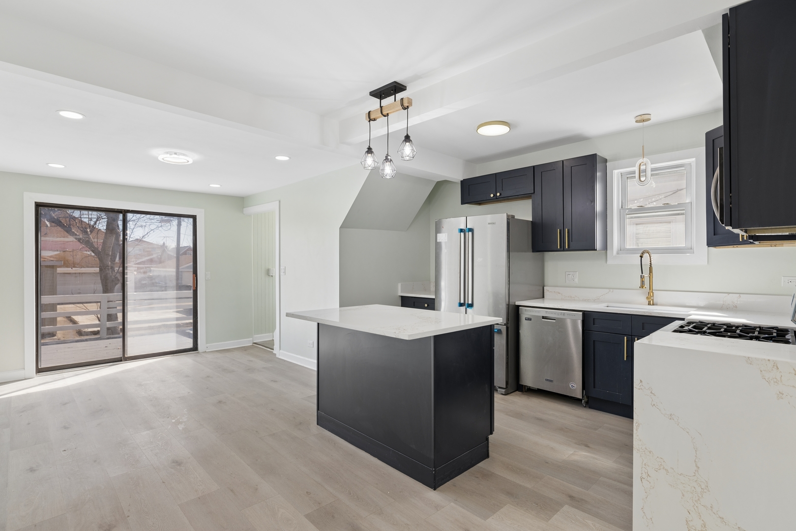 6347 South Kenneth Avenue Chicago, IL 60629 - Photo 6 of 40 a kitchen with kitchen island a sink stainless steel appliances and cabinets