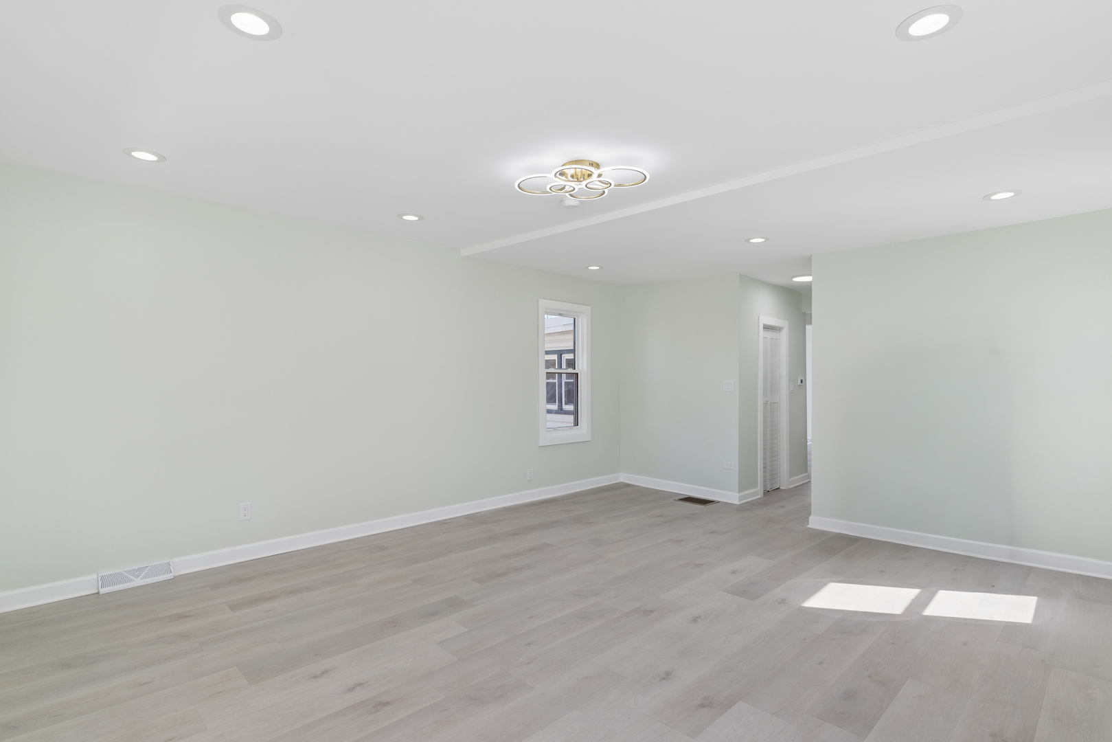 6347 South Kenneth Avenue Chicago, IL 60629 - Photo 9 of 40 an empty room with a empty space and a ceiling fan