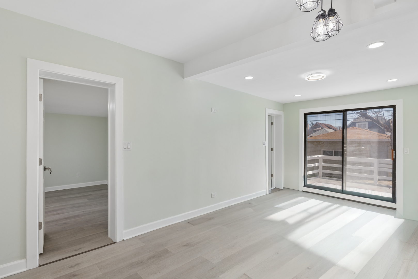 6347 South Kenneth Avenue Chicago, IL 60629 - Photo 10 of 40 an empty room with wooden floor and windows