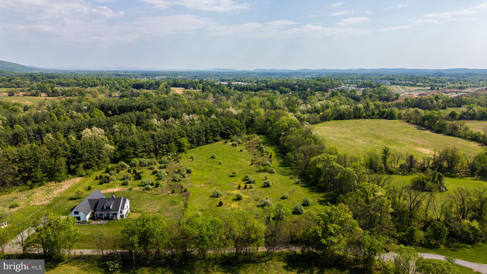 Lot 24 Simmons Road Purcellville, VA 20132 - Photo 12 of 13 a view of a city with lush green forest