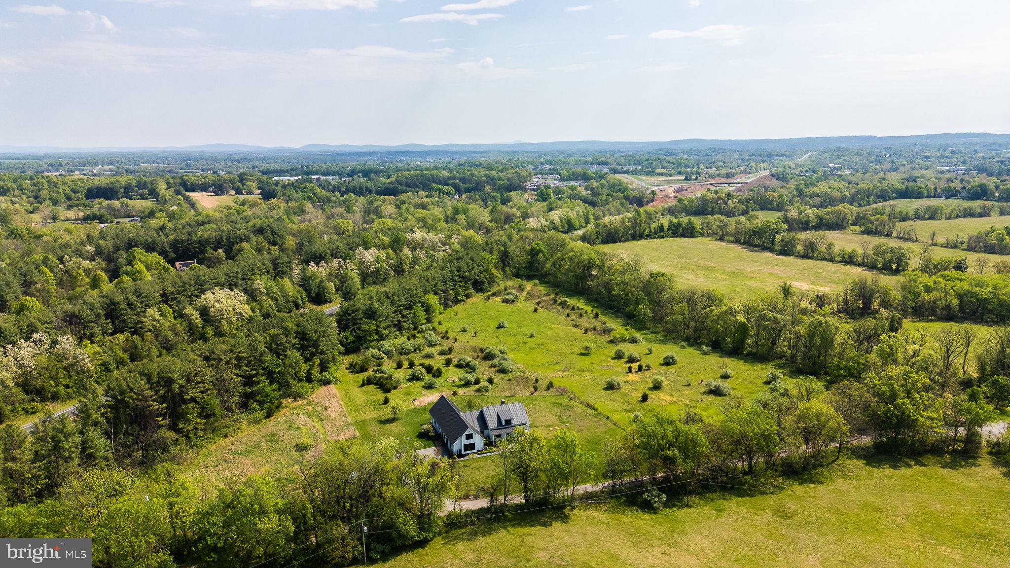 Lot 24 Simmons Road Purcellville, VA 20132 - Photo 3 of 13 a view of a bunch of trees and houses