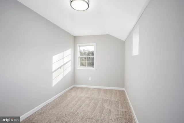 a view of hallway with windows