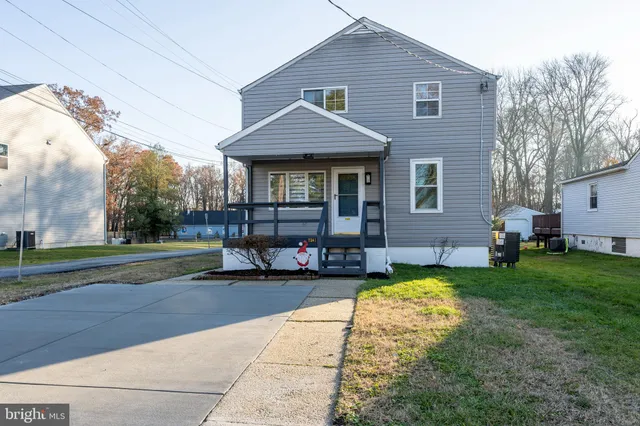 a view of a house with sitting area and garden