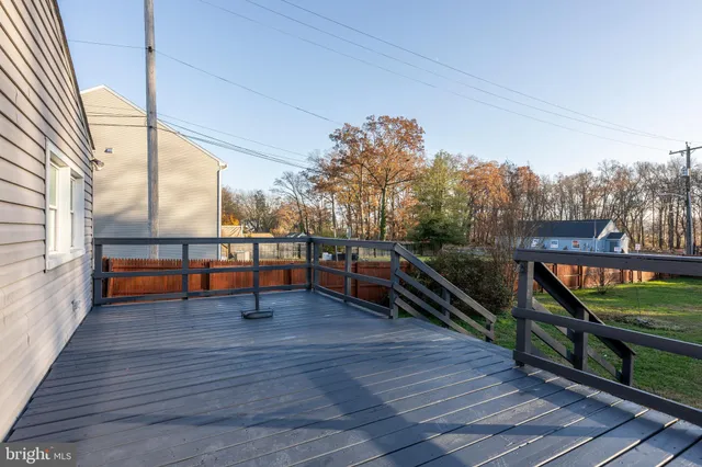 a view of a house with wooden deck