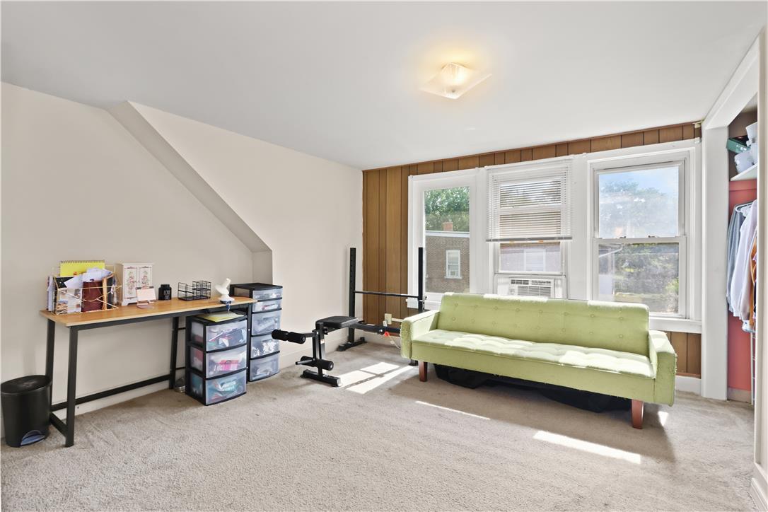 431 Pierce Street Bethlehem, PA 18015 - Photo 18 of 27 Well-lit room with ample natural light, soft carpeting, and a functional built-in storage area.