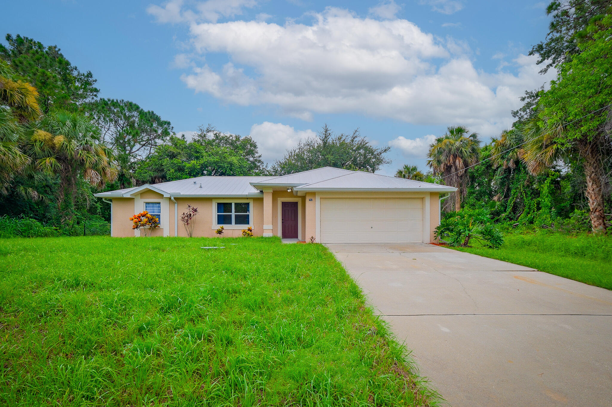 762 Gerlitz Road Southwest Palm Bay, FL 32908 - Photo 29 of 29 a view of a yard in front of a house with large trees