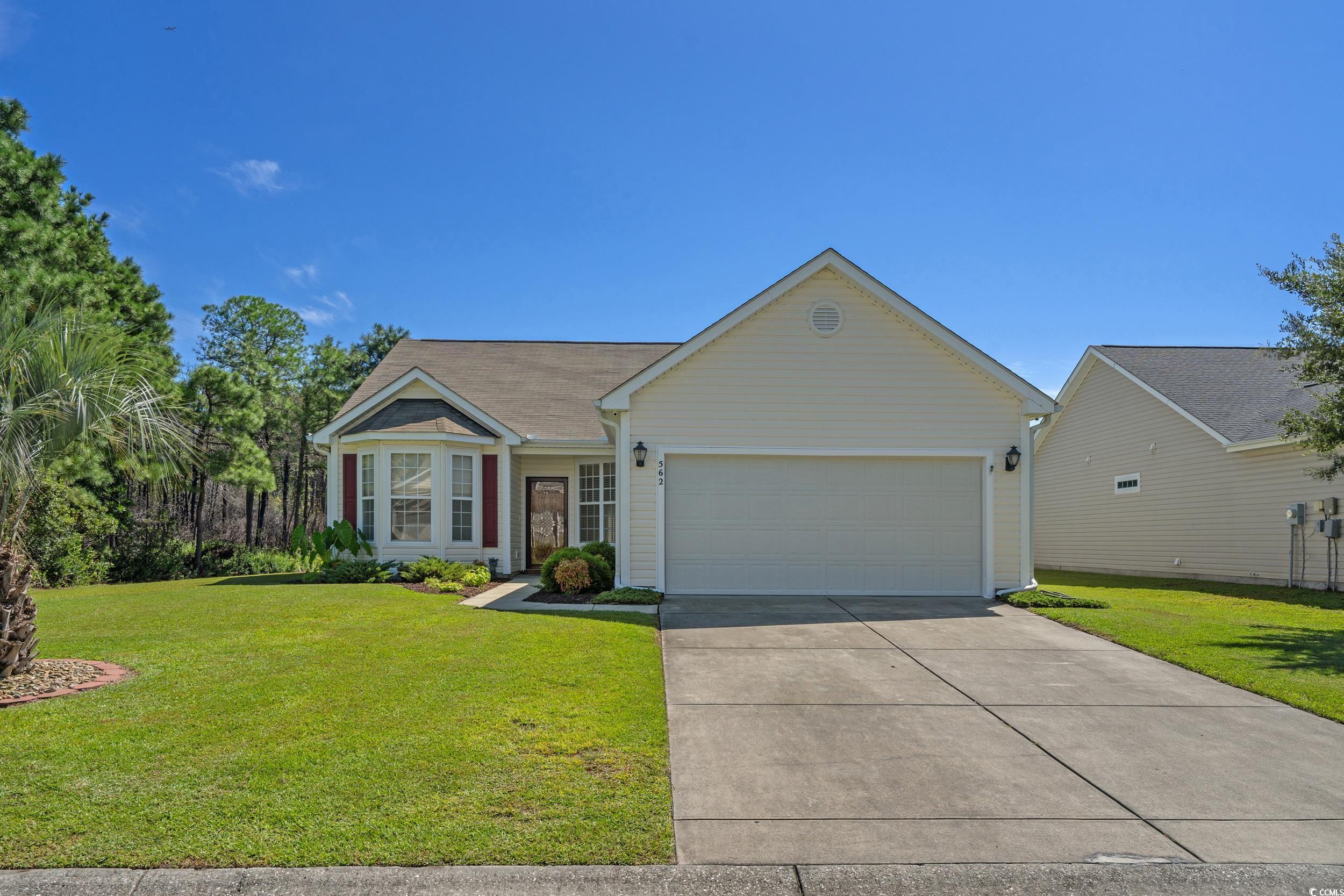 562 Tuckahoe Road Myrtle Beach, SC 29579 - Photo 1 of 40 Ranch-style home featuring a front lawn, concrete driveway, and a garage