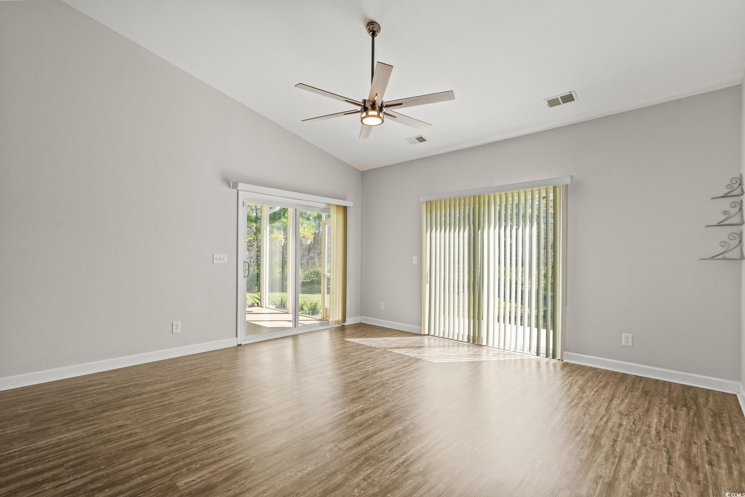 562 Tuckahoe Road Myrtle Beach, SC 29579 - Photo 14 of 40 Spare room with lofted ceiling, wood finished floors, and ceiling fan