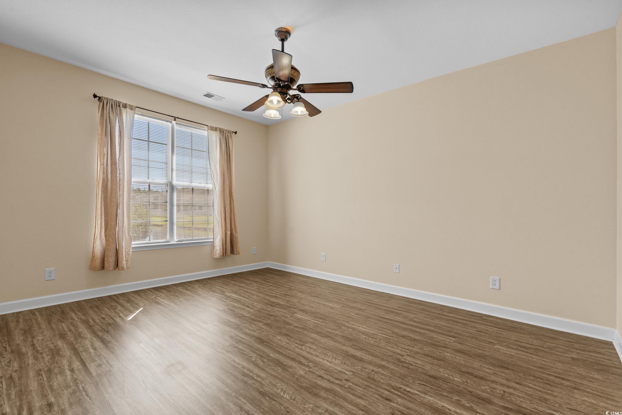 562 Tuckahoe Road Myrtle Beach, SC 29579 - Photo 18 of 40 Empty room featuring dark wood finished floors and ceiling fan