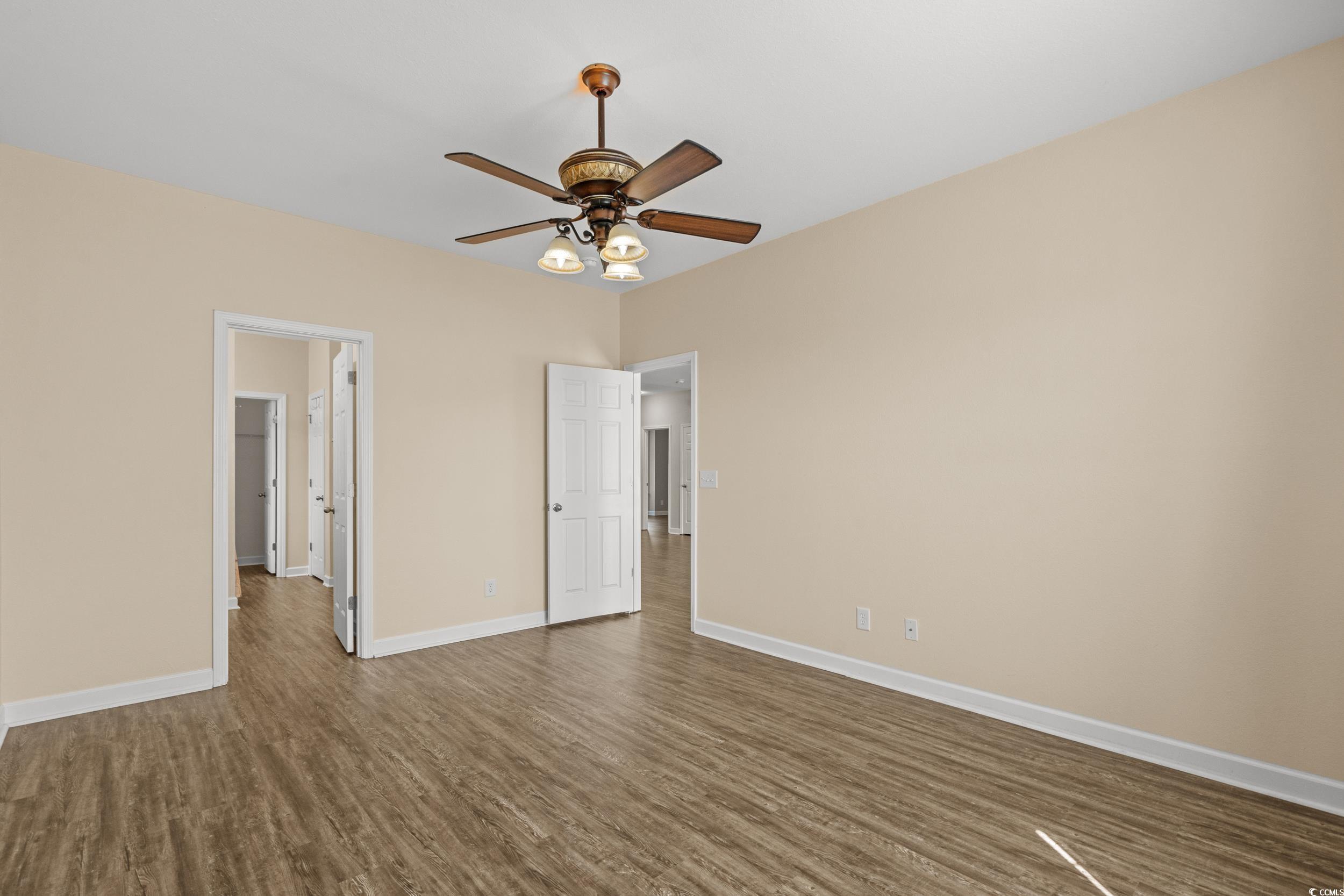 562 Tuckahoe Road Myrtle Beach, SC 29579 - Photo 19 of 40 Unfurnished bedroom with dark wood-style floors and ceiling fan
