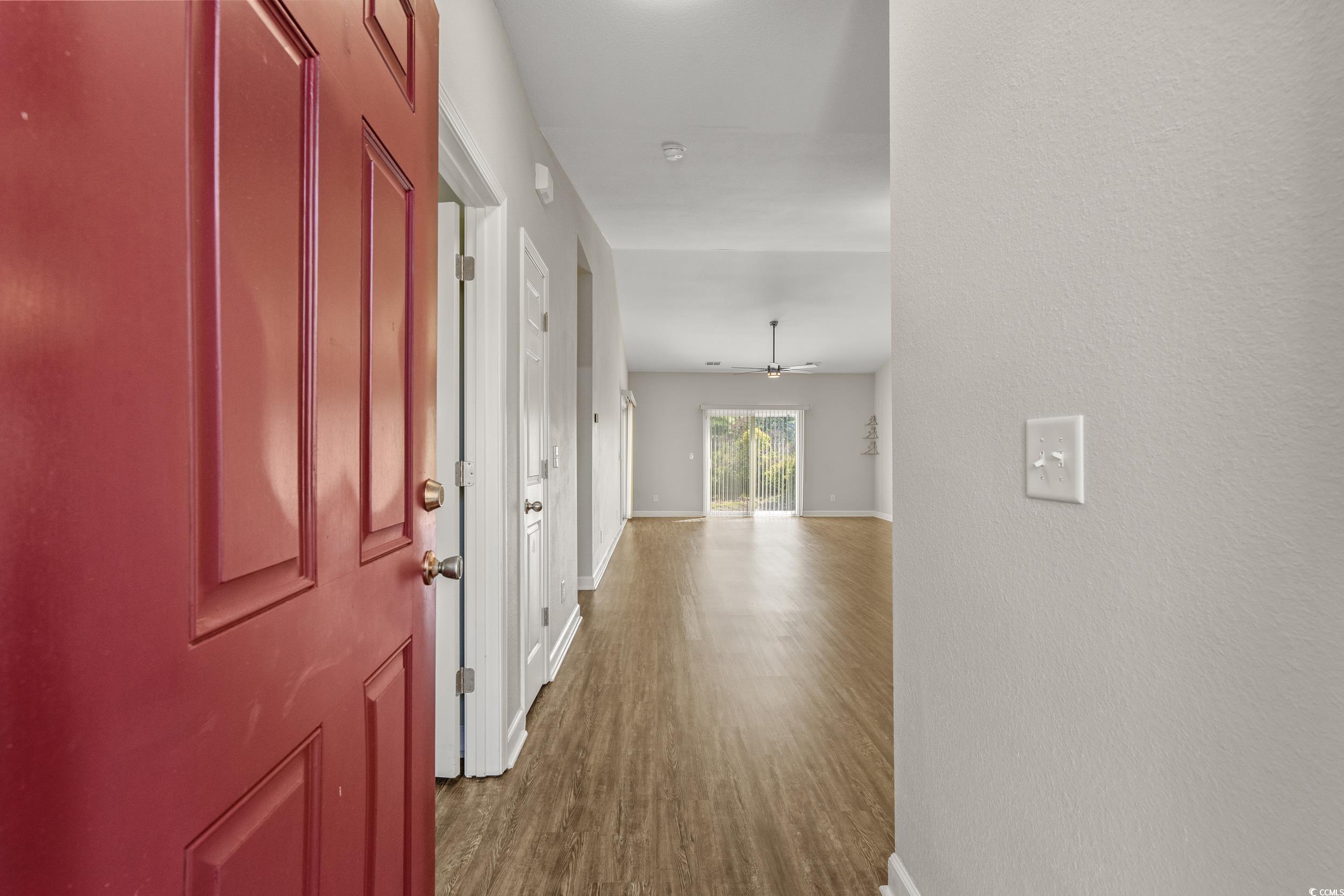562 Tuckahoe Road Myrtle Beach, SC 29579 - Photo 2 of 40 Entryway with dark wood-type flooring, a ceiling fan, and a textured wall