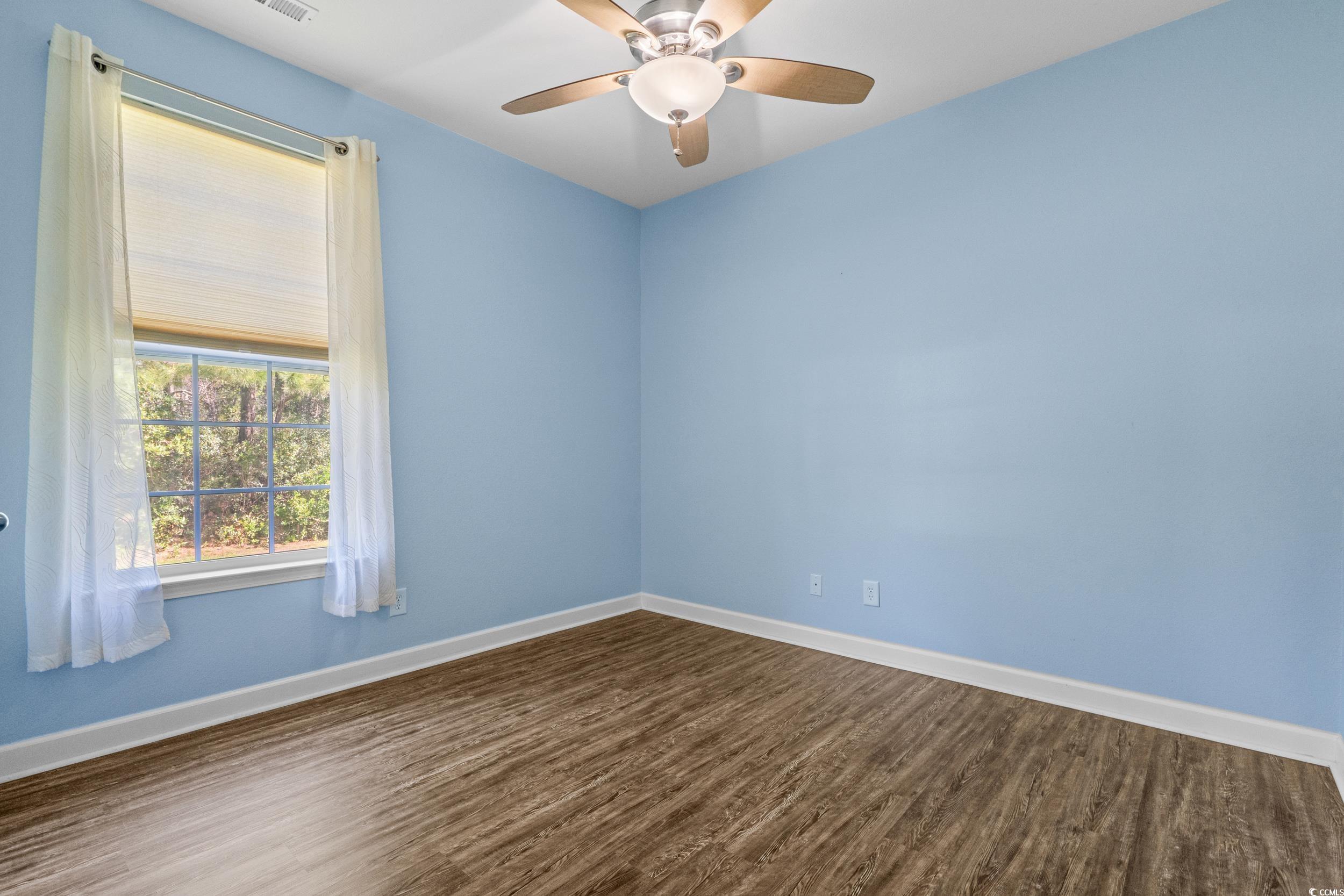 562 Tuckahoe Road Myrtle Beach, SC 29579 - Photo 23 of 40 Spare room with dark wood-style floors and a ceiling fan