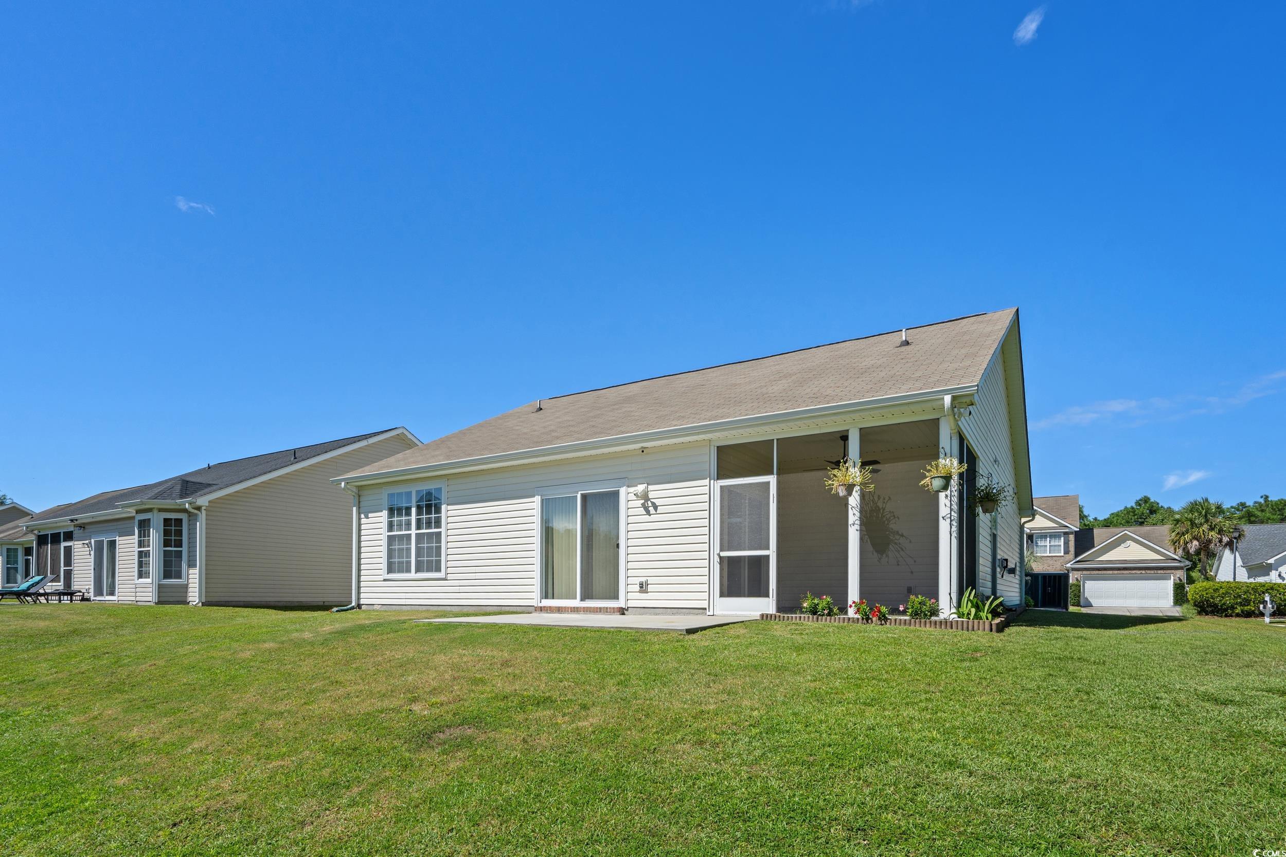 562 Tuckahoe Road Myrtle Beach, SC 29579 - Photo 28 of 40 Back of property featuring a yard and a patio